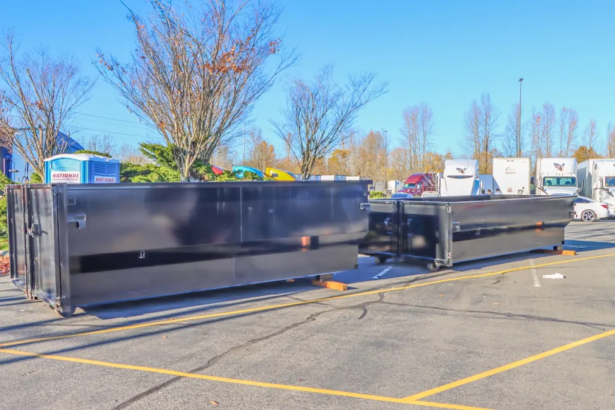 Professional dumpster rental service with roll-off container on residential driveway in Centralia
